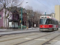 Rolling south on a 510 Spadina run (but short turning at King, hence the sign), TTC CLRV streetcar 4127 crosses the intersection of Spadina Avenue and Willcocks Street to pick up passengers waiting on the LRT platform to the south. The old row houses that line the west side of Spadina, likely dating from the mid-to-late 1800's, are a stark contrast to some of the more modern 1960's and newer apartments and offices to the north near Bloor, and much of the University of Toronto campus that lines the east side of Spadina.<br><br>And for more Spadina action:<br>Passing in the night: <a href=http://www.railpictures.ca/?attachment_id=8781><b>http://www.railpictures.ca/?attachment_id=8781</b></a><br>Rounding 1 Spadina Crescent: <a href=http://www.railpictures.ca/?attachment_id=4867><b>http://www.railpictures.ca/?attachment_id=4867</b></a>