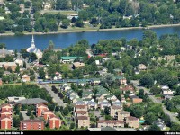 VIA #23 pass into the town of Mont-Saint-Hilaire, Qc at 77 mph. You can see a part of the Richelieu river in the top of the picture. I walked 2.6 km to get this shot at an altitude of 413m.