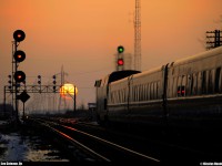 As the sun get down slowly, VIA 65 pass Les Coteaux station by a crispy winter evening.