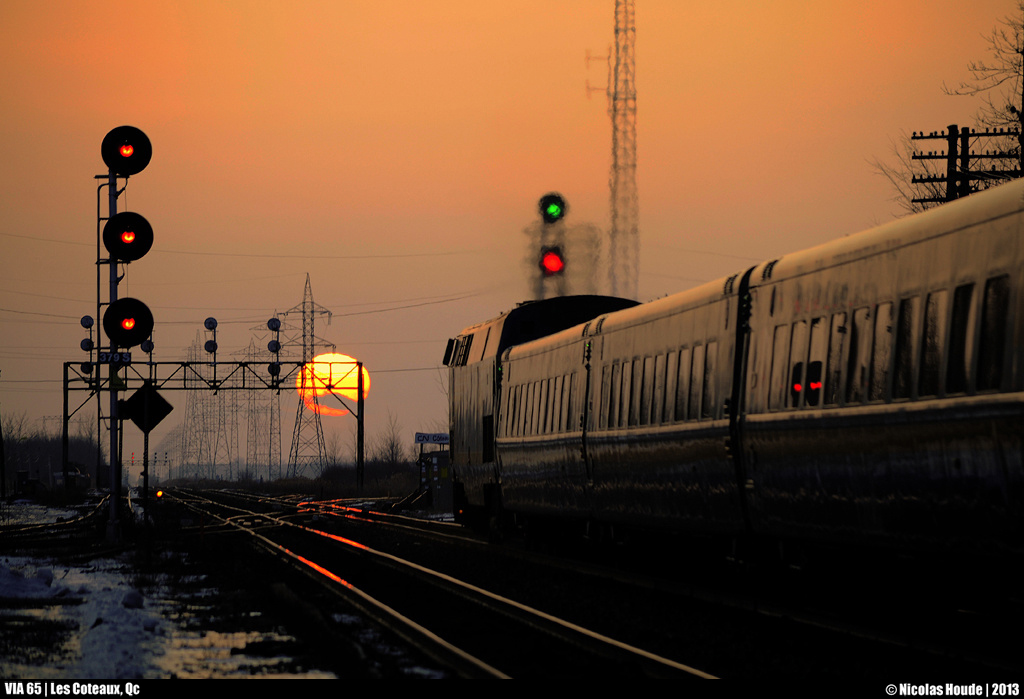 As the sun get down slowly, VIA 65 pass Les Coteaux station by a crispy winter evening.