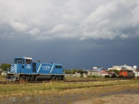 CEFX 1507 sits next to CN 5448 in the CN Brandon Yard after an intense rain storm.