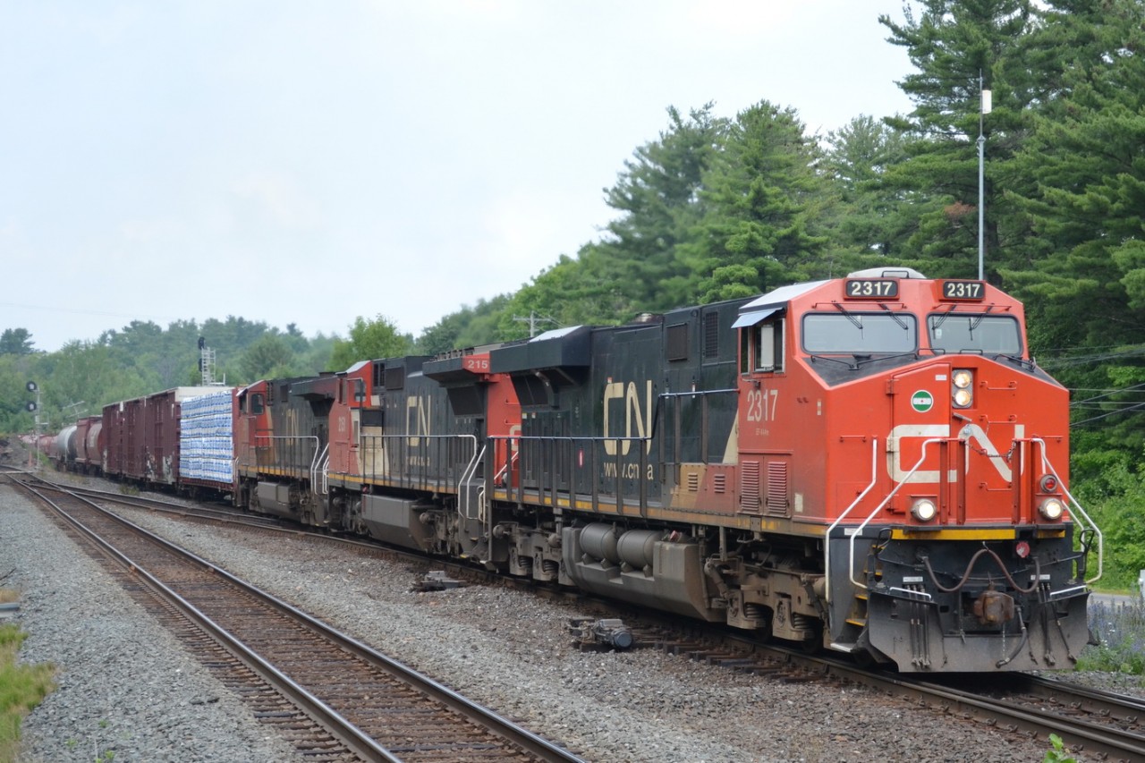 CN 2317 leads a mixed freight east through Parry Sound.