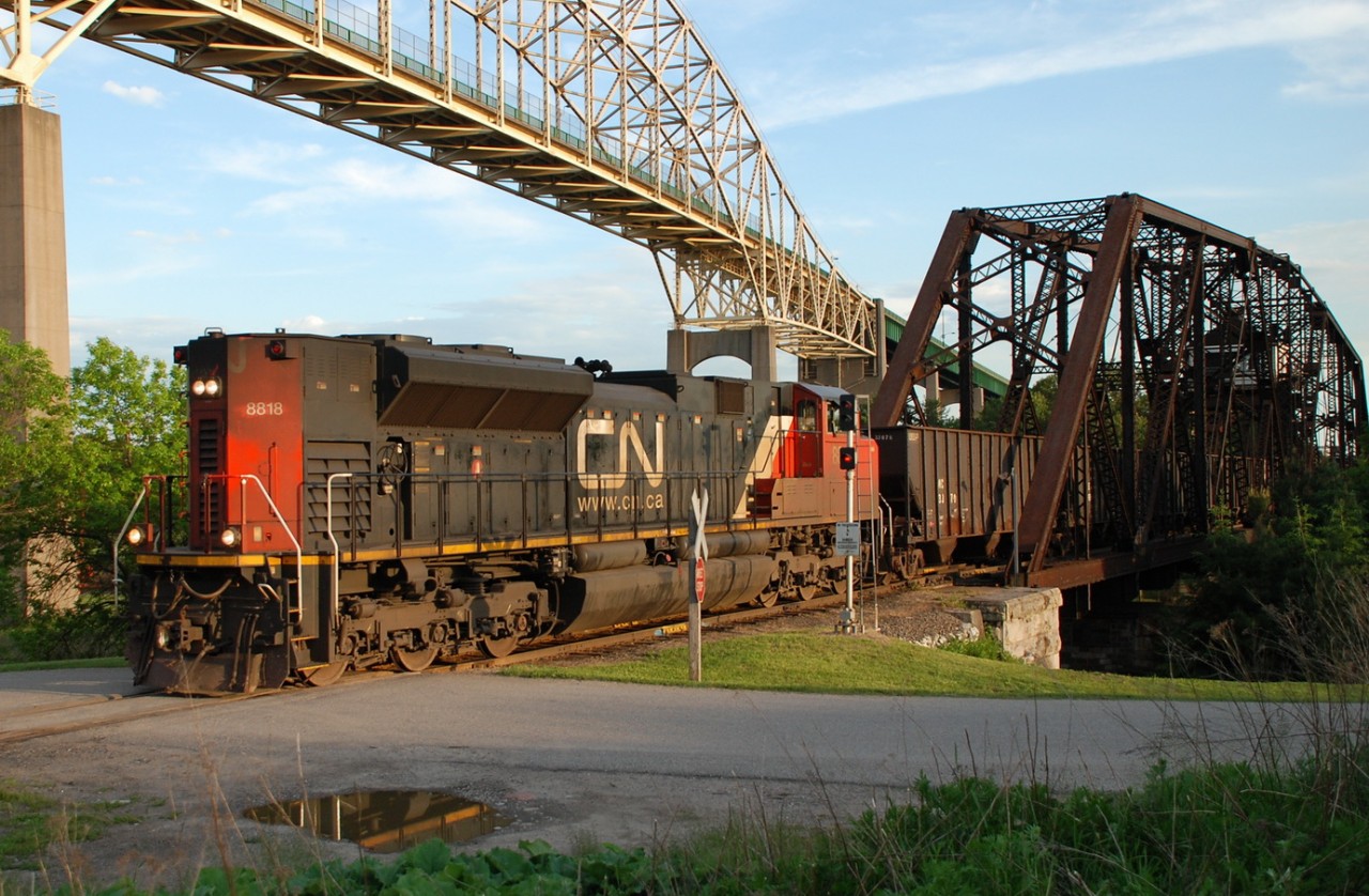 CN 8818 runs high hood forward leading a shorter then normal CN 551. There was no DPU on this train.