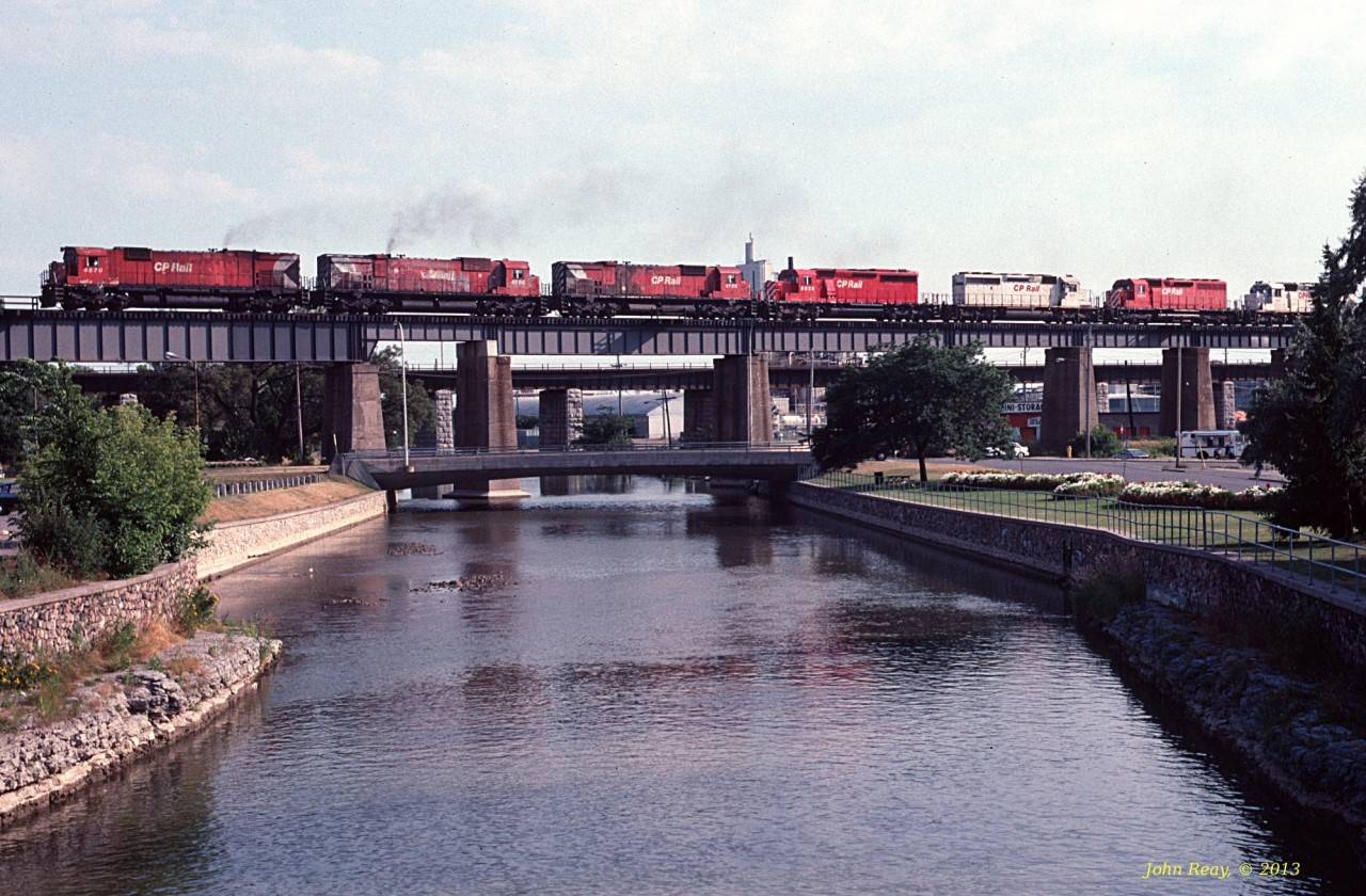 The quintessential early 1990s CP Belleville sub lash-up (3 big MLWs and 4 SDs) crossing the Ganaraska river in Port Hope, ON on an eastbound. September 1993. Co-ordinates are for where I was standing to capture this shot.