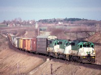 Three GO Transit weekend leasers power this CP westbound on the Belleville sub in April 1988. This was shot looking south east from Bests Road (off Wesleyville Road south of highway 401.) Don't bother today, as it's totally overgrown.