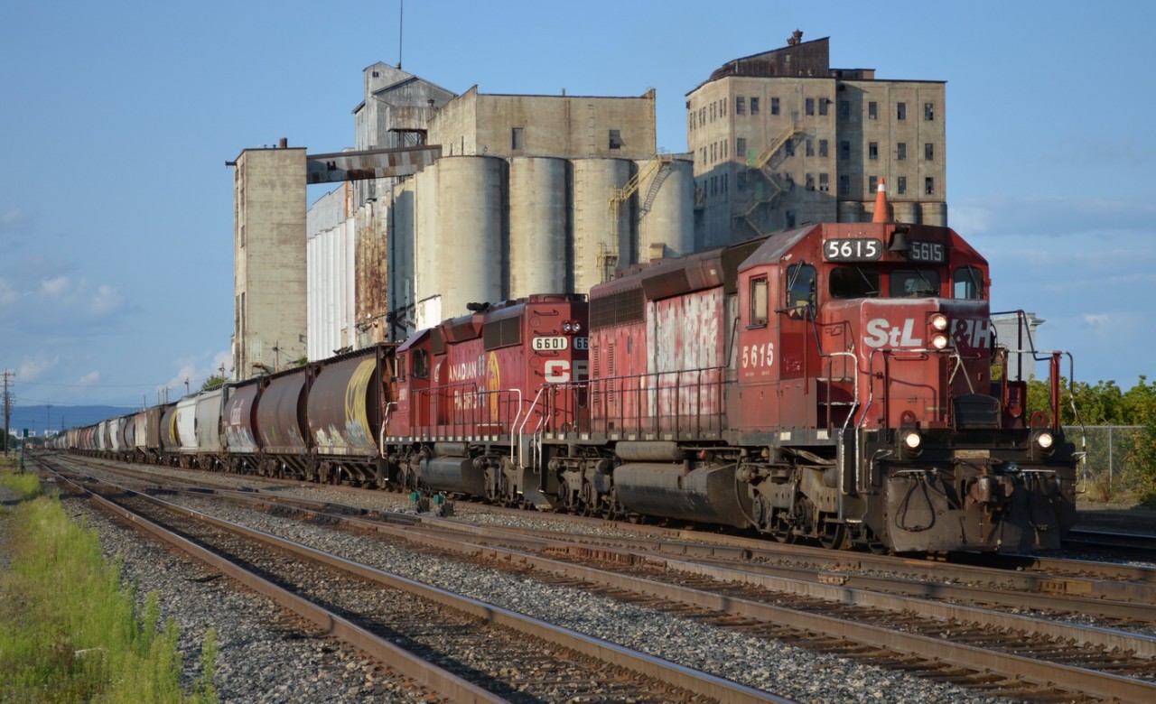 With a lengthy train in tow, STL&H 5615 heads west.