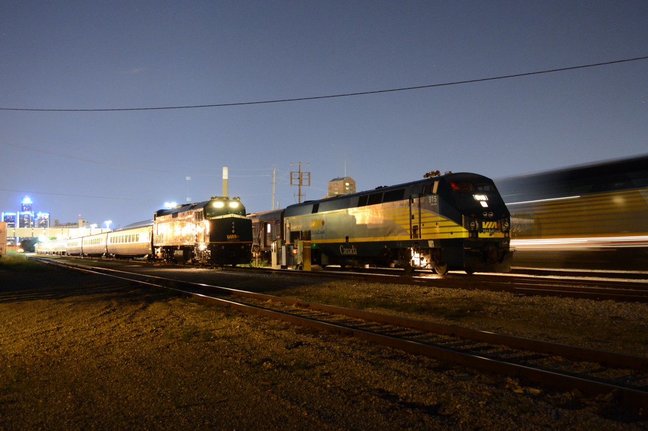 VIA 6456 sits on the Outer track, with 6459 on the other side of the train, waiting for tomorrow's departure on 76, VIA 915 had just arrived into the Station, just before 79 arrived, but was waiting to go over to the next track, and VIA 6439 backs out of the station, to wye its train. It was a busy night in Windsor, at the Station, around 11pm.