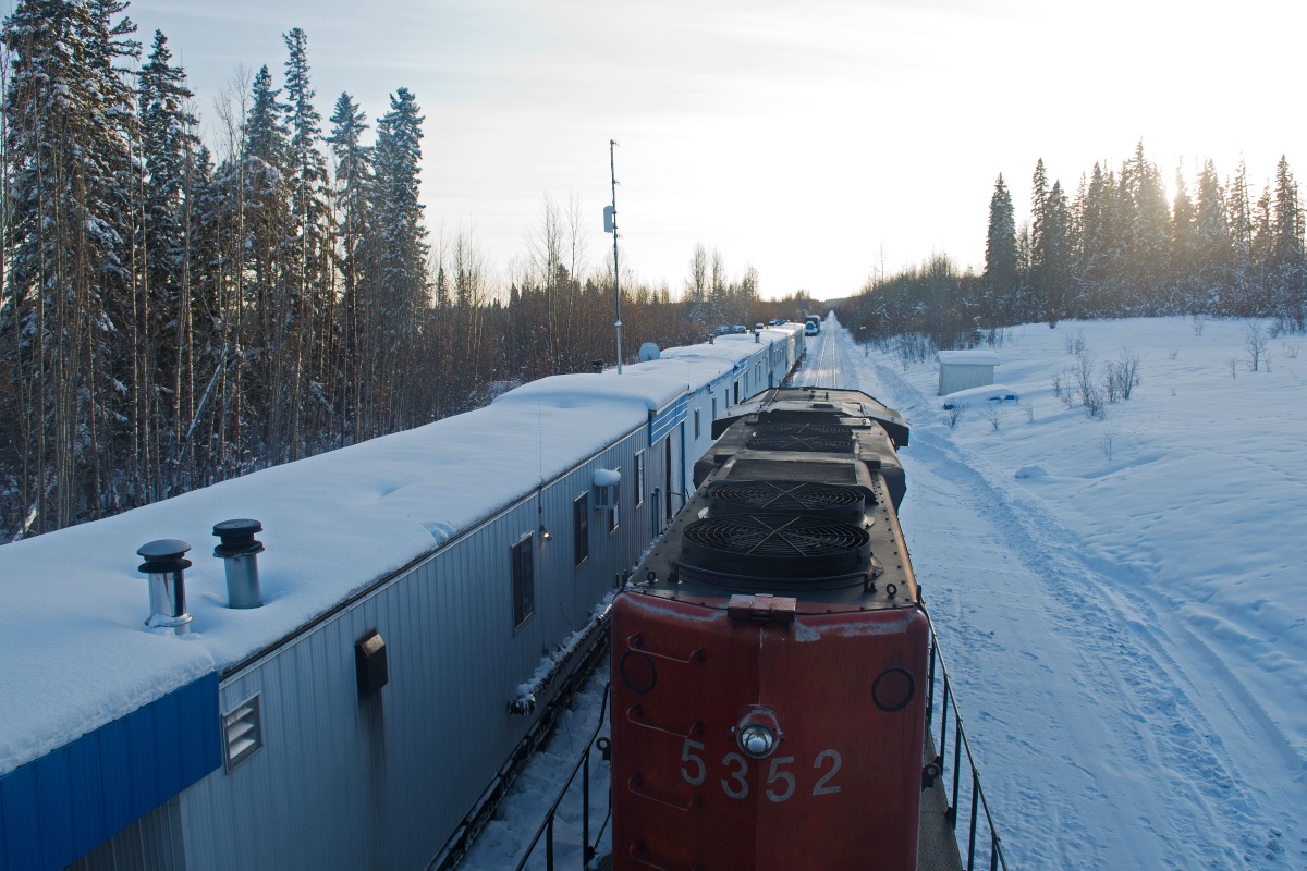 Welcome to Gutah camp !  Gutah is at mile 864 of the former BCR, on the Fort Nelson Subdivision. This picture is looking south towards Fort St John (136 miles away) and Fort Nelson is 113 miles behind me. There is no road access to Gutah and the closest crossing is 60 miles away. Trains "go off and on" here, meaning that one trip ends on paper and a new one begins. This is a way around rest rules that prevent crews form working more than 12 hours at a time. There is a cook stationed here and section crews, train crews can book rest and "go to bed" here, but its not that common. If you do "go to bed" here, make sure it is in the correct car, there is an engineman's  car (with the most comfy beds), a brakeman's car, a section car, and so on.  After the tragic fatality of a conductor at Gutah (the day after I took this photo) there was talk of building an access road, but nothing has happened as of yet.