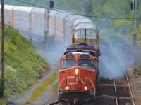 CN 2220 and a BCR GE drift through Hamilton West with RNIX 1001 as the the third unit. The switcher was smoking badly and required the crew to stopp in Aldershot to see what the issue was before continuing on.