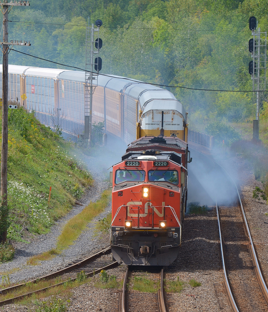 CN 2220 and a BCR GE drift through Hamilton West with RNIX 1001 as the the third unit. The switcher was smoking badly and required the crew to stopp in Aldershot to see what the issue was before continuing on.