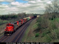 A trio of rebuilt GP9's lead the London to Sarnia 'transfer' today as it rounds the bend at Denfield Road.  Nothing beat the sound of old first generation Geeps pulling a big train up grade, and believe me, this train did not disappoint.  :-)