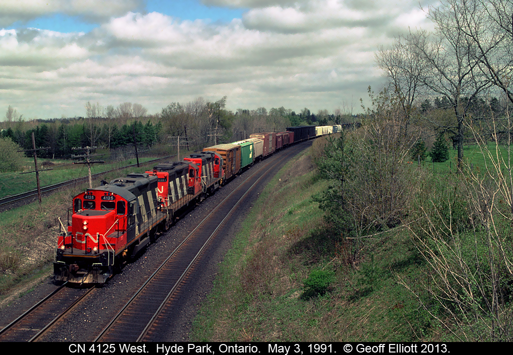 A trio of rebuilt GP9's lead the London to Sarnia 'transfer' today as it rounds the bend at Denfield Road.  Nothing beat the sound of old first generation Geeps pulling a big train up grade, and believe me, this train did not disappoint.  :-)