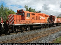 CP GP9 #1602 and slug #1015 are in transit, but sitting in the siding, in Belle River, Ontario on September 13, 2013.  This pair has apparently been sold and is en-route to the new owner.