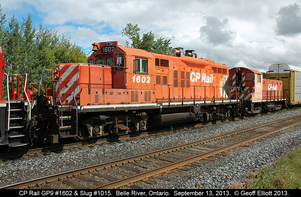CP GP9 #1602 and slug #1015 are in transit, but sitting in the siding, in Belle River, Ontario on September 13, 2013.  This pair has apparently been sold and is en-route to the new owner.