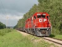 A rare move, CP Work Hoadley with 3092 and 3020 is shown here idling at Aspen Beach. The day after this photo was taken, the train would move farther to around Forshee. The Hoadley Sub had been very inactive for around two years prior, due to poor track conditions and (rumored) contract issues with their only producer on the line, the gas plant at Homeglen/Rimbey. It was quite active in 2012, but traffic seems to have greatly declined again in 2013.