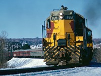 Train No. 2 charges uphill just south of Searchmont. Train has extra coaches and cafe cars added for the "Snow Train".