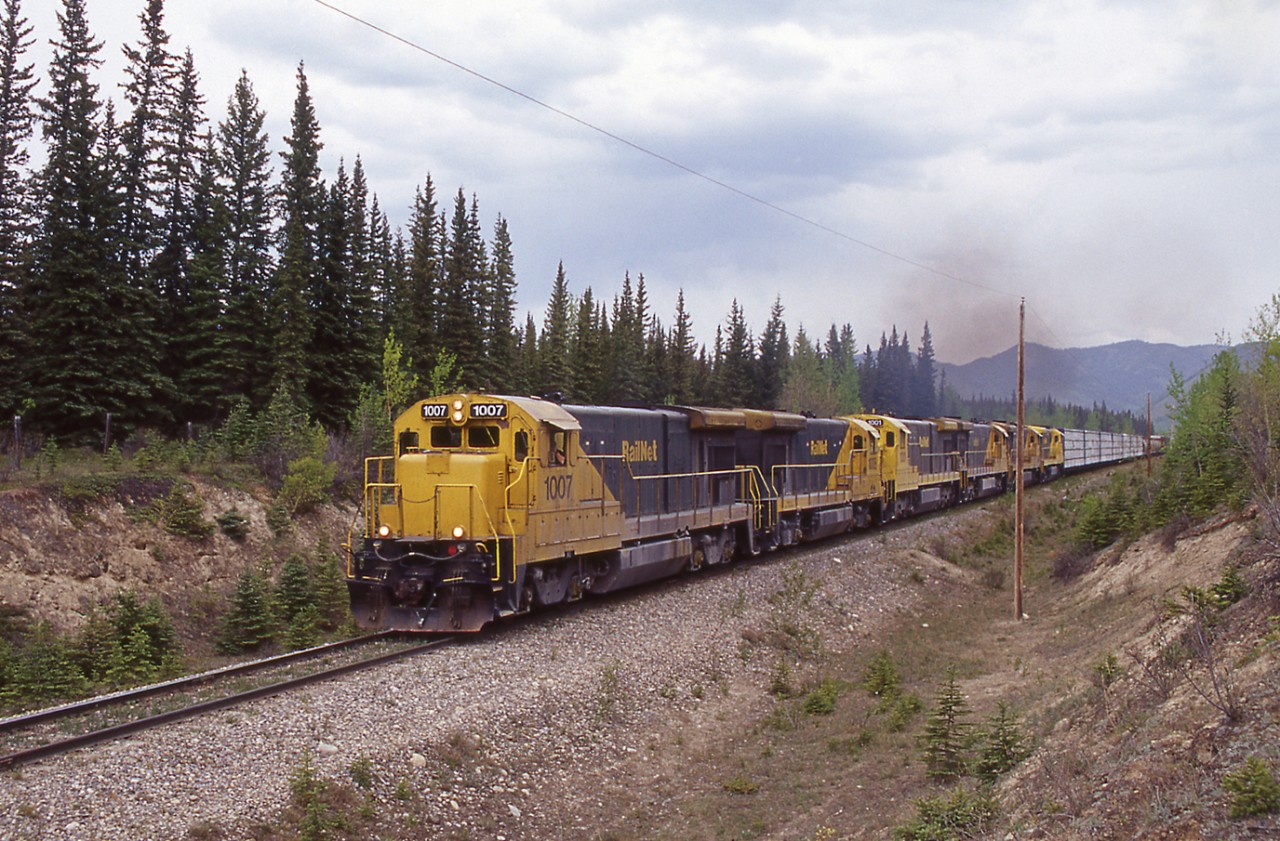 Southbound freight rolls into Swan Landing with an impressive collection of GE Dash 7 diesels.