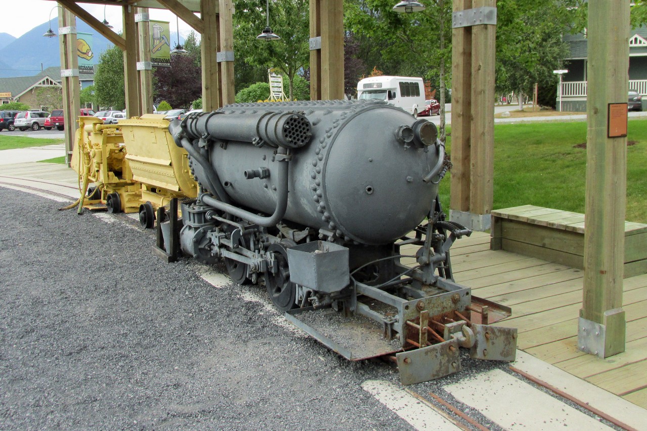 1912 built H.K. Porter Compressed Air Locomotive on display at Britania Mine Museum. These  sort of locomotives were pre-charged  with air, this one to 5515 kpa, and used in mines where explosive gases made electric power unsafe.  This locomotive hauled coal at the Canmore Coal Mine in Alberta.