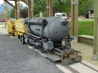 1912 built H.K. Porter Compressed Air Locomotive on display at Britania Mine Museum. These  sort of locomotives were pre-charged  with air, this one to 5515 kpa, and used in mines where explosive gases made electric power unsafe.  This locomotive hauled coal at the Canmore Coal Mine in Alberta.