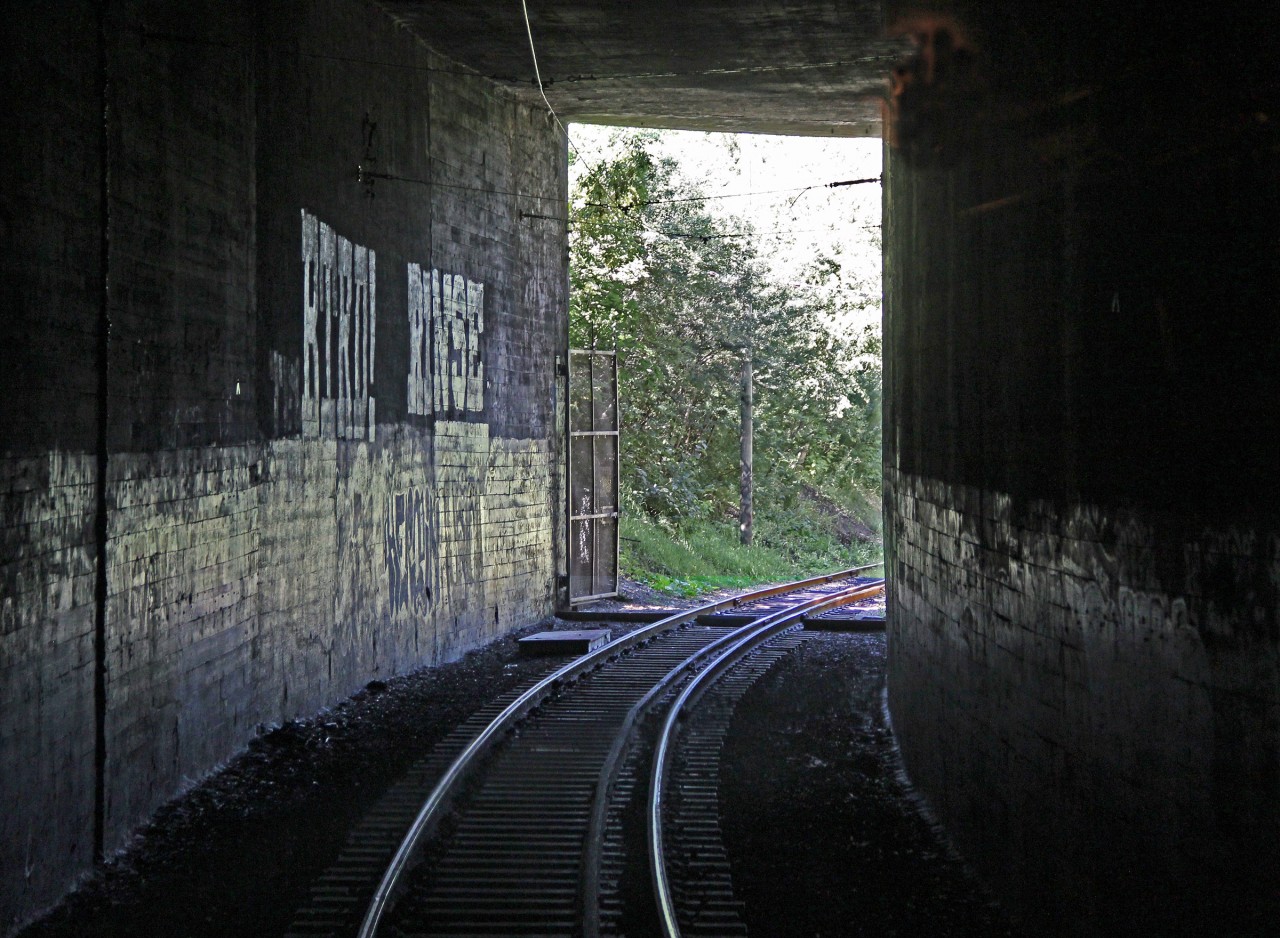 Riding the tram on the ex CP tracks between Old Strathcona and Edmonton Jasper Plaza the 109 Street tunnel north  portal is viewed from within the tunnel.  (Don't try and get this view if not riding the tram - it would be dangerous and you would be trespassing!)