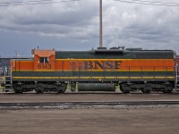 Someone pulled a fast one! BNSF SD9 6143 pays back horespower hours to CN in 2005. 