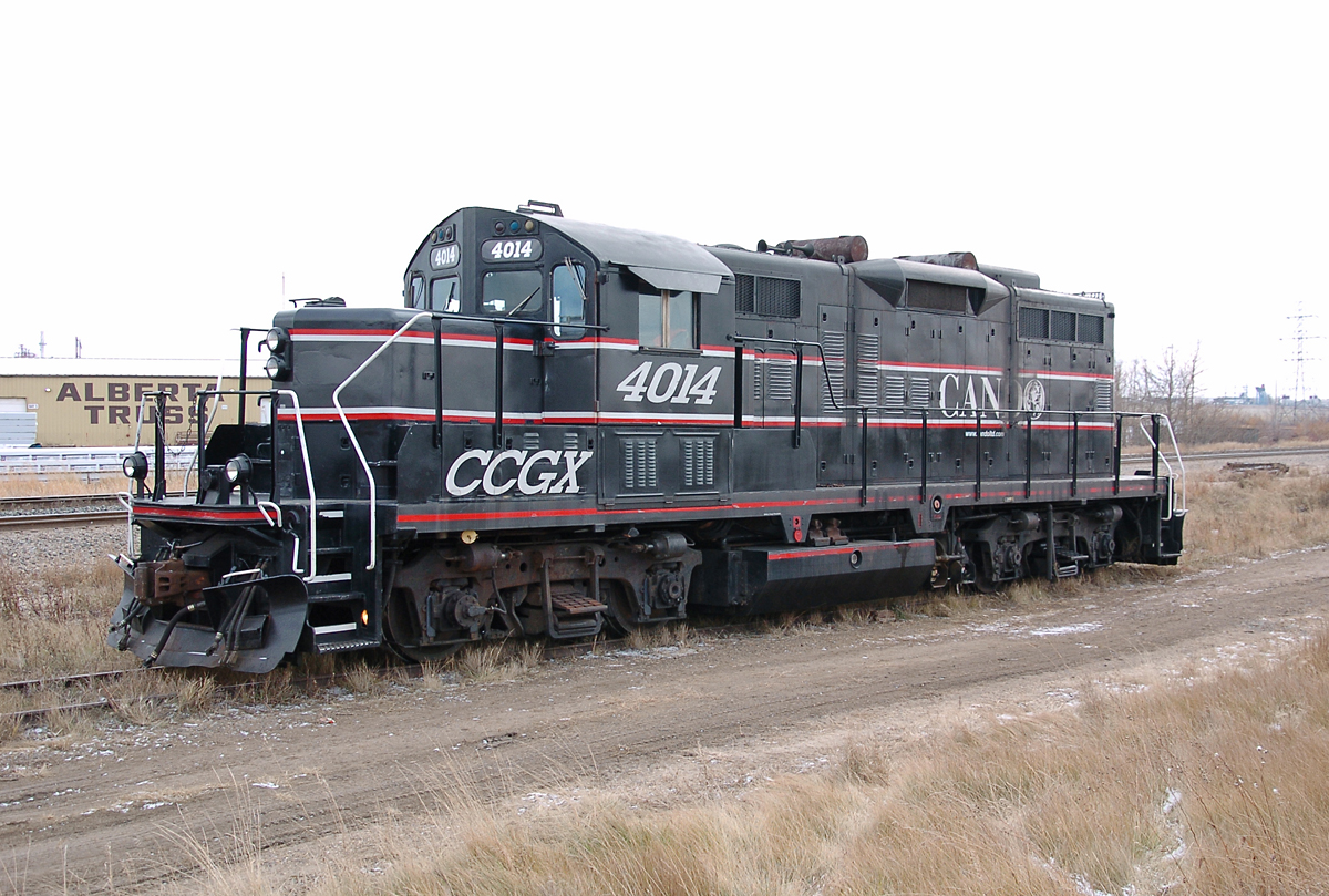 CCGX 4014, an ex-CN GP9RM owned by Cando Contracting, idles on a siding at around Mile 2 on the CN Camrose Sub. The facility that it works at, Esso Imperial Oil, is just a little ways north.