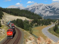 An ex-BNSF C40-8W leads train 119 through scenic Jasper National Park.