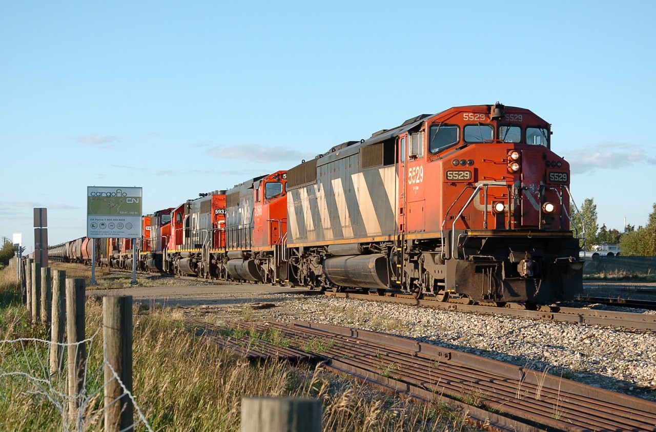 A great 6-unit all-EMD/GMD consist of CN 5529, 5266, GTW 5937, CN 5279, GTW 5933, and CN 9581 pull their train south headed for Walker Yard. This mixed freight train was around 136 cars long, with many being loaded (centerbeam flat) cars, which maybe explains why such a large (18,800 hp) consist was used. Some units may have been inactive though.