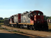 A pair of 1950's built GMD GP9RM's shoving hard on the tail end of CN 435, who has CN 8002 - BCOL 4618 - CN 7029 on the head end