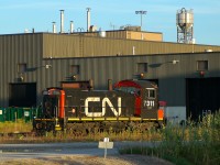 CN SW1200RSm 7311 basking in the evening sunlight behind Mac Yard's diesel shop