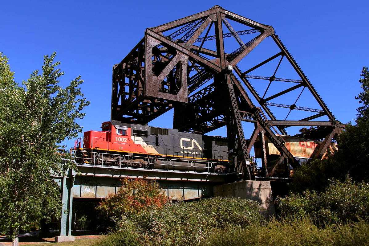 Q101's mid train DPU exits the west end of CN's crossing of the Red River.