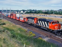 CN 5357 and 5358 lead an eastbound intermodal train off the York Sub at Pickering