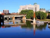 A CN manifest crosses the Assiniboine River just west of Winnipeg's Union Station.