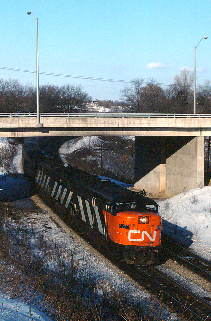 With just months to go before VIA takes over passenger operations, CN 6772 leads a great looking CN 75 under Plains Road and through Bayview Junction, on a clear crisp February afternoon.