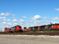 While the CN Racecourse yard job waits patiently with 1444 in the clear, CN 509 sets off their Aldershot cars onto track CL 13 at the east end of the yard. The train had waited at Ridout until an X509 departed the yard westbound for Sarnia. Must have been confusing for the yardmaster having two 509's, one in each direction!