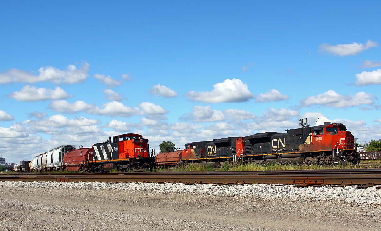 While the CN Racecourse yard job waits patiently with 1444 in the clear, CN 509 sets off their Aldershot cars onto track CL 13 at the east end of the yard. The train had waited at Ridout until an X509 departed the yard westbound for Sarnia. Must have been confusing for the yardmaster having two 509's, one in each direction!
