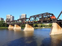 The tail end of CN's Q101 crosses the Red River and heads into Winnipeg's downtown area.
