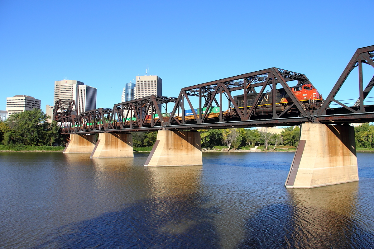 The tail end of CN's Q101 crosses the Red River and heads into Winnipeg's downtown area.