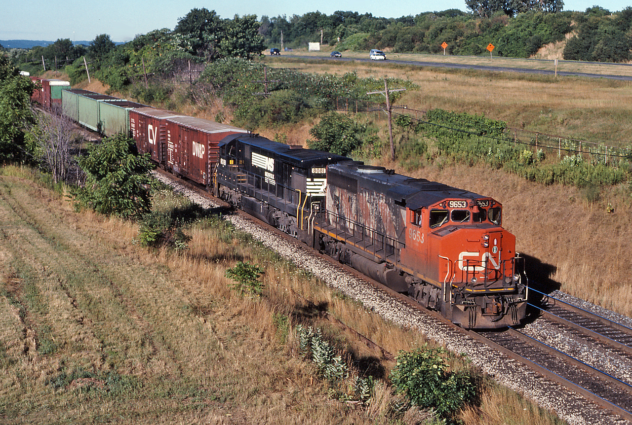 CN 332 climbs the grade out of Bayview with CN 9653 and NS 8081.