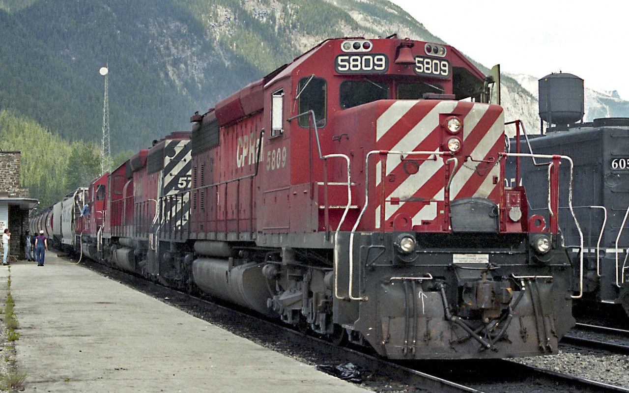 The outbound crew of CP 5809 West adds some water to the trailing unit before departing for Revelstoke. The SD40-2 was the king of the road in June of 1994!