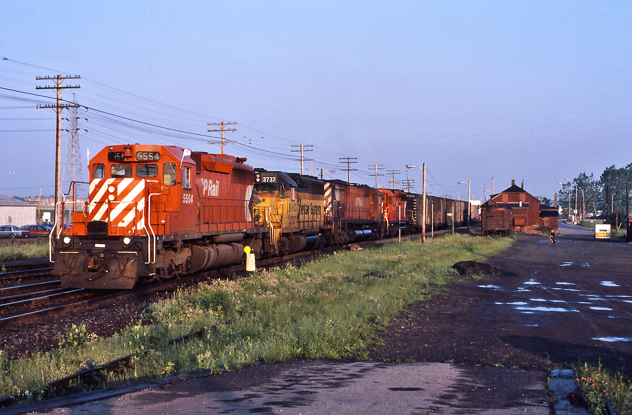 CP 5554 leads an early morning eastbound through Dorval with a nice assortment of power.