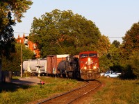 Late in the evening, CP 235 pulls out of Quebec Street yard and rolls around the westernmost curve on the Galt sub. From here, the line is straight as an arrow for more than five miles as it climbs westward to Lobo. With a clearance to Ringold, CP 235 ended up waiting over an hour for an over-siding-length 142 to clear after being recrewed at the begin/end CTC sign London (St. George street). CP 142 is typically recrewed there as it is usually too long to fit at Quebec Street without blocking road crossings. 