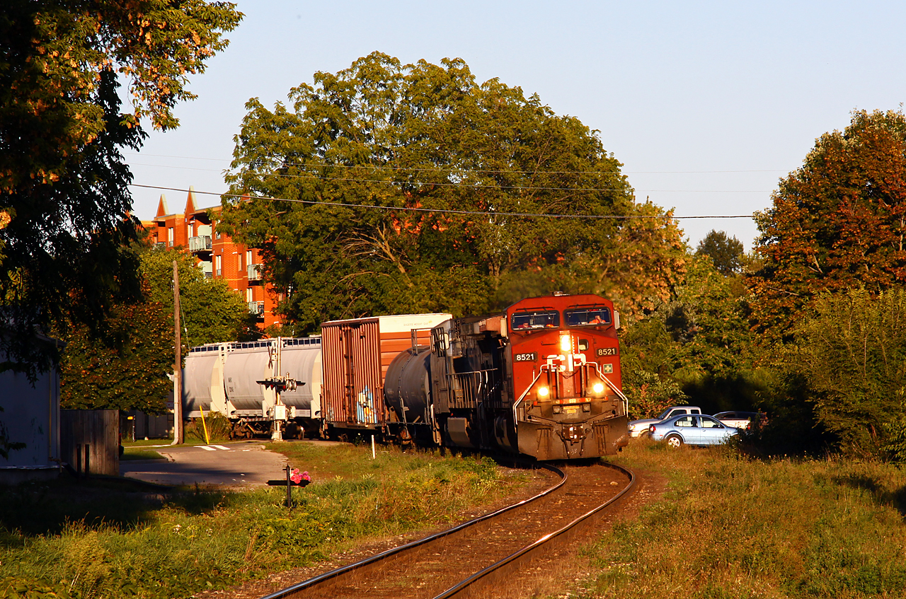 Late in the evening, CP 235 pulls out of Quebec Street yard and rolls around the westernmost curve on the Galt sub. From here, the line is straight as an arrow for more than five miles as it climbs westward to Lobo. With a clearance to Ringold, CP 235 ended up waiting over an hour for an over-siding-length 142 to clear after being recrewed at the begin/end CTC sign London (St. George street). CP 142 is typically recrewed there as it is usually too long to fit at Quebec Street without blocking road crossings.