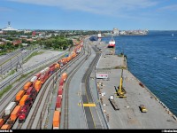 By a gorgeous afternoon, CP 118 slowly gets in the port of Montreal beside the beautiful Saint-Lawrence river. You can also see one of the symbols of Montreal ; the Olympic Stadium, builted in April 1973 for the Olympic's game in summer 1976.