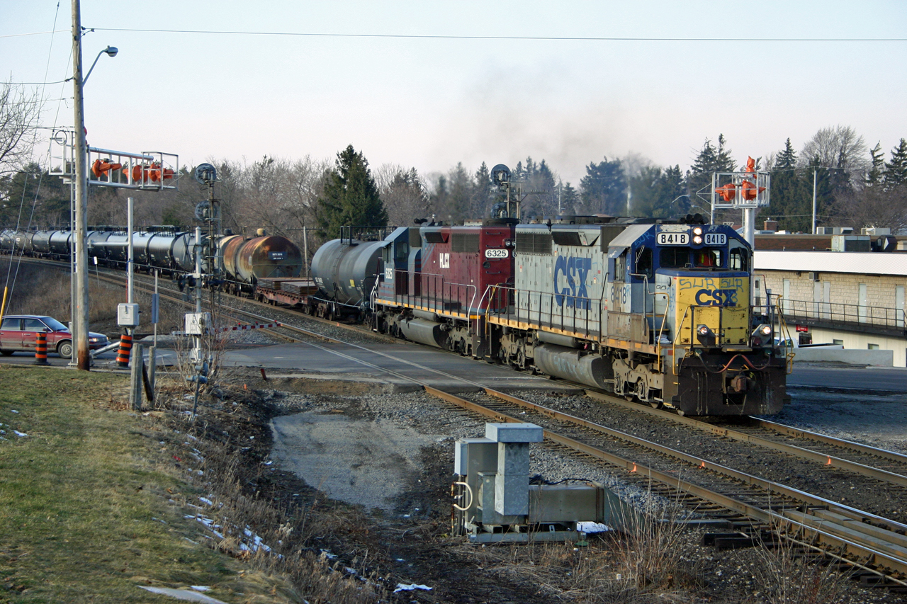 CN 394 gets underway after sitting at Hardy waiting for another east bound to finish working the yard at Brantford.  Back at the height of FPON, 394 typically featured BNSF power; however today we find a ratty looking CSXT 8418 and a clean HLCX 6325 providing the power.