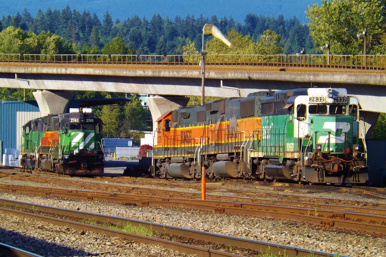 Two sets of BNSF power sit on the locomotive tracks at Braid yard on a warm May evening. The power includes to GP39-2s (ex GP30s) and two ex ATSF GP60B's.