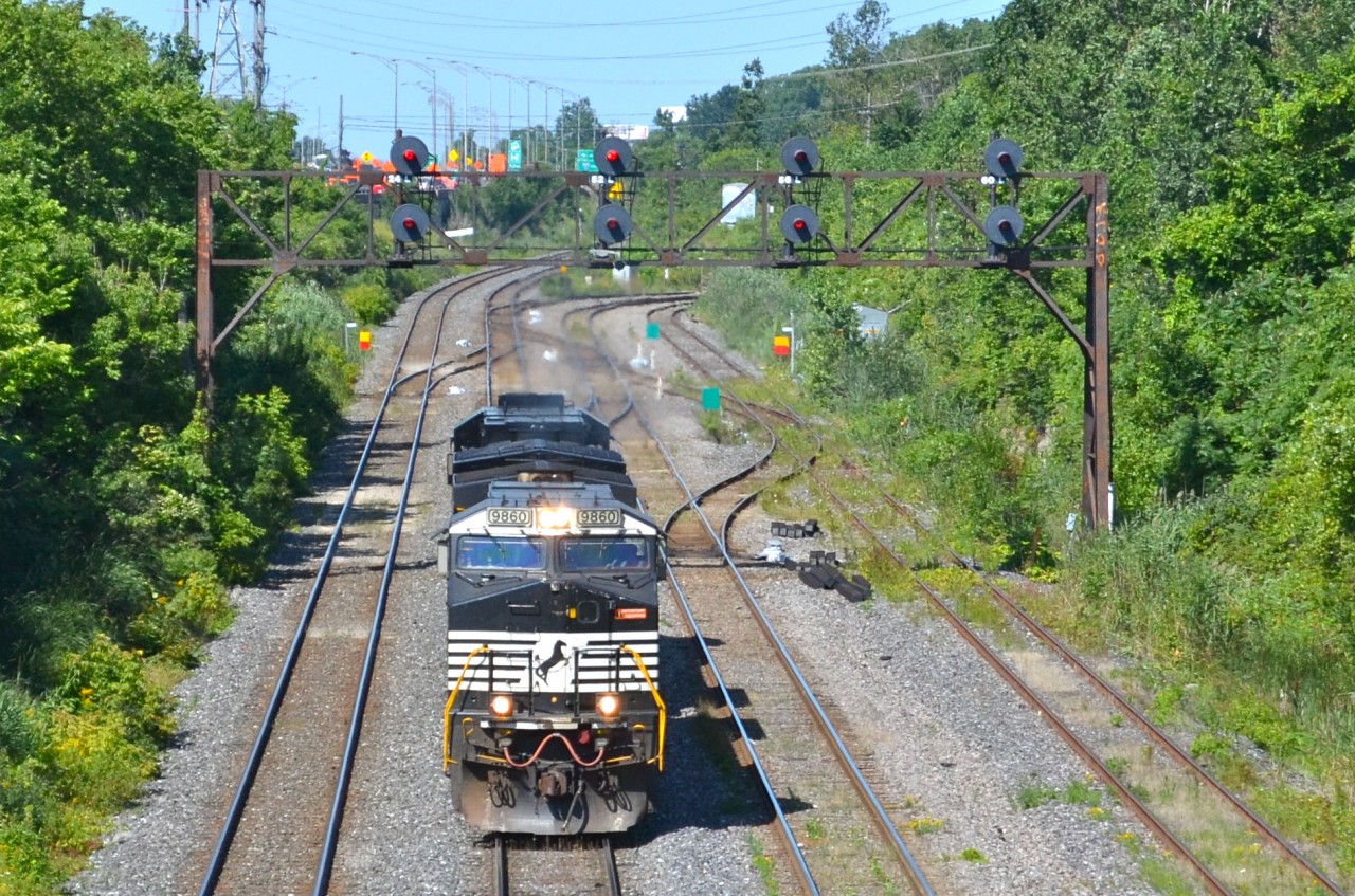 This was the first run of CN 528, a new train replacing CP 930, which used to operate on CP trackge from St-Luc Yard to Harrisburg, usually with Norfolk Southern power. CN 528 will run on CN tracks till Rouses Point, NY. It has just exited Taschereau Yard and is on its way to L'Acadie, Qc to pick up its train. The next few weeks after this, the train would not operate out of Taschereau Yard, but out of Southwark Yard in St-Lambert. Since then it has been renumbered to 328 and now operates out of Taschereau Yard again.