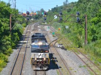 This was the first run of CN 528, a new train replacing CP 930, which used to operate on CP trackge from St-Luc Yard to Harrisburg, usually with Norfolk Southern power. CN 528 will run on CN tracks till Rouses Point, NY. It has just exited Taschereau Yard and is on its way to L'Acadie, Qc to pick up its train. The next few weeks after this, the train would not operate out of Taschereau Yard, but out of Southwark Yard in St-Lambert. Since then it has been renumbered to 328 and now operates out of Taschereau Yard again. 