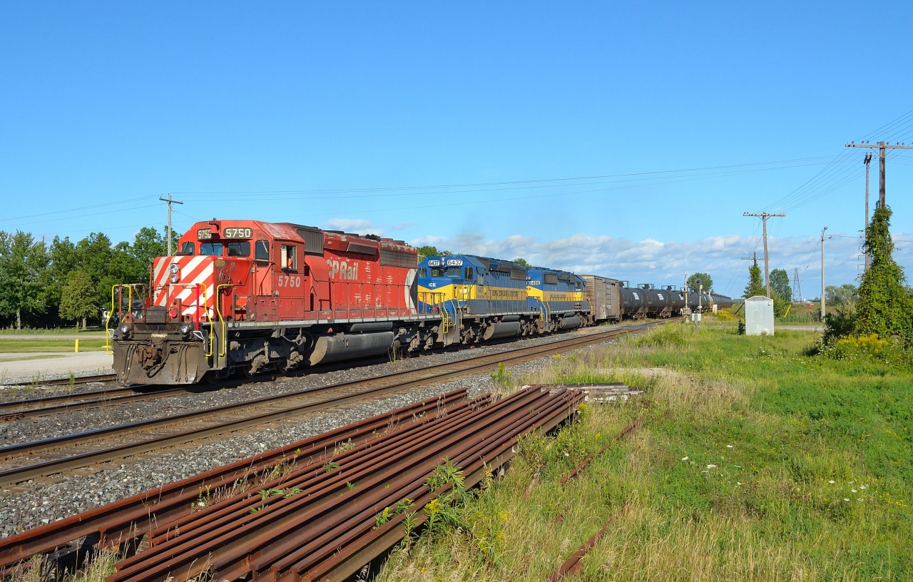 CP 641 led by CP 5750- ICE 6437- ICE 6406 heads into the siding at Tilbury to allow an eastbound to pass by.