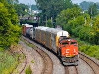 CN 401 heads west through Montreal West, led by CN 8017 (missing part of its nose noodle) and CN 9450. Five cars back from the head end is a Bombardier Multilevel car destined for New Jersey Transit. It will be interchanged to CP at Montreal for furtherance to the Bombardier plant in Plattsburgh, NY. For more train photos, check out http://www.flickr.com/photos/mtlwestrailfan/